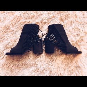 Black fringe open toe and backless heeled booties